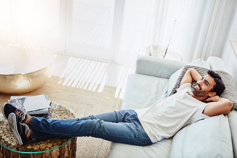 Man Leaned Back On Couch